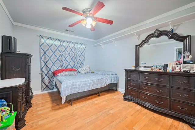 a bedroom with a bed and dresser