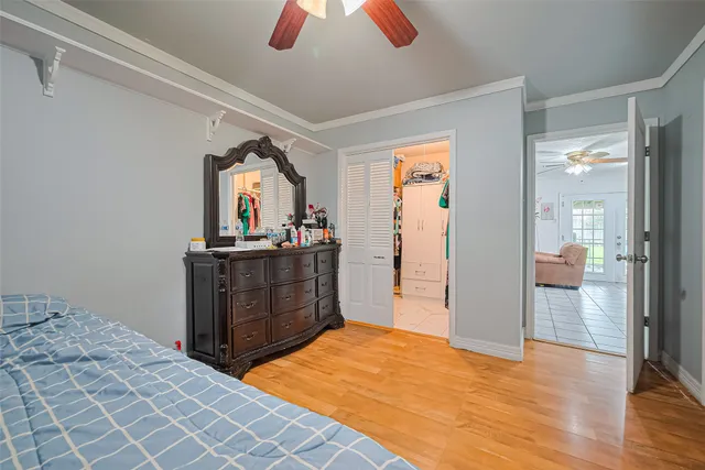 a bedroom with a bed and a dresser