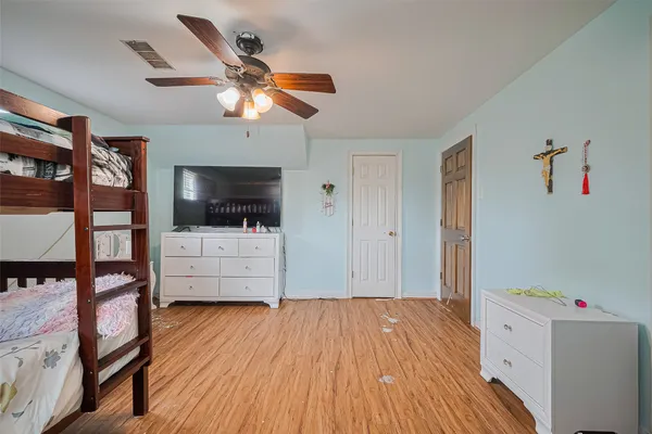 a view of a livingroom with furniture and flat screen tv