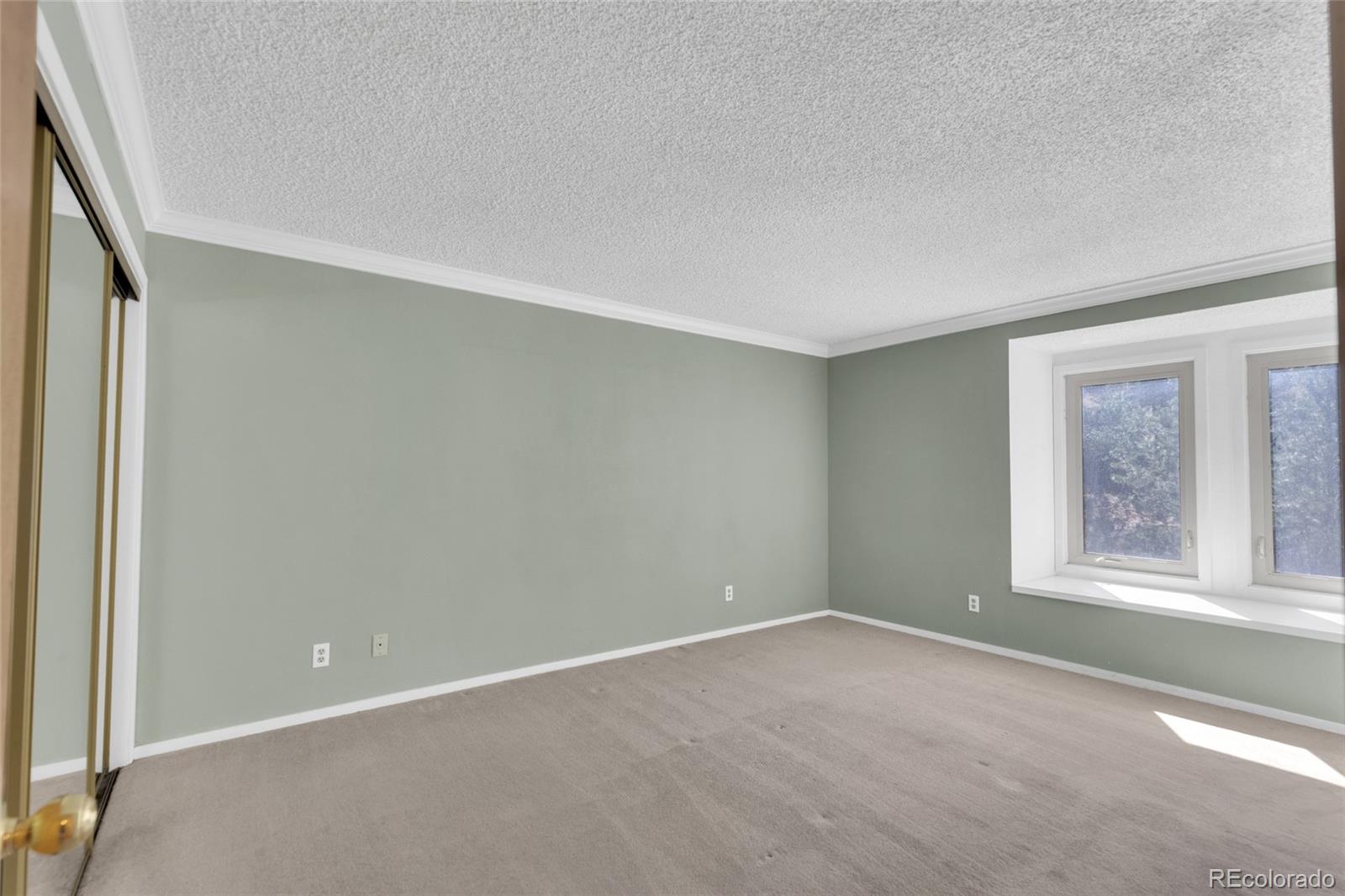 23537 Genesee Village Road Golden, CO 80401 - Photo 14 of 37 an empty room with a window