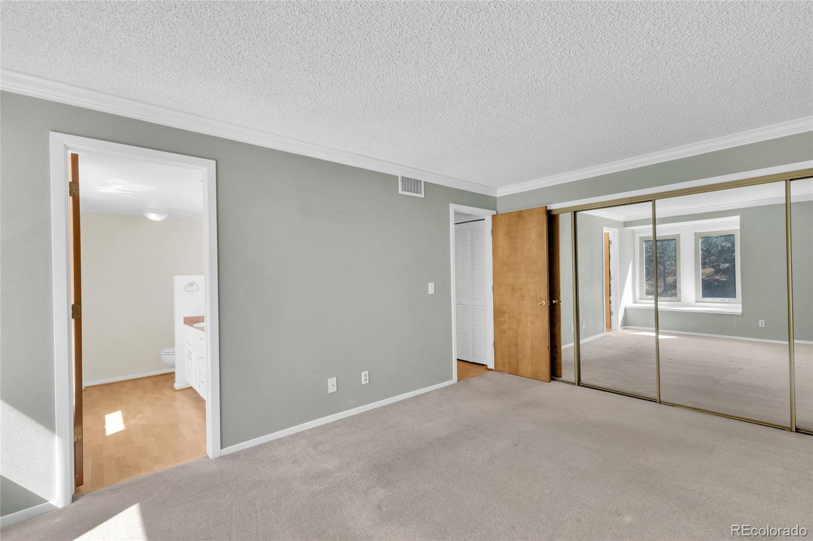23537 Genesee Village Road Golden, CO 80401 - Photo 15 of 37 a view of an empty room with a window
