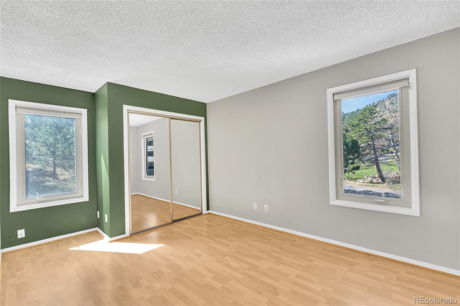 23537 Genesee Village Road Golden, CO 80401 - Photo 18 of 37 a view of an empty room with closet and a window