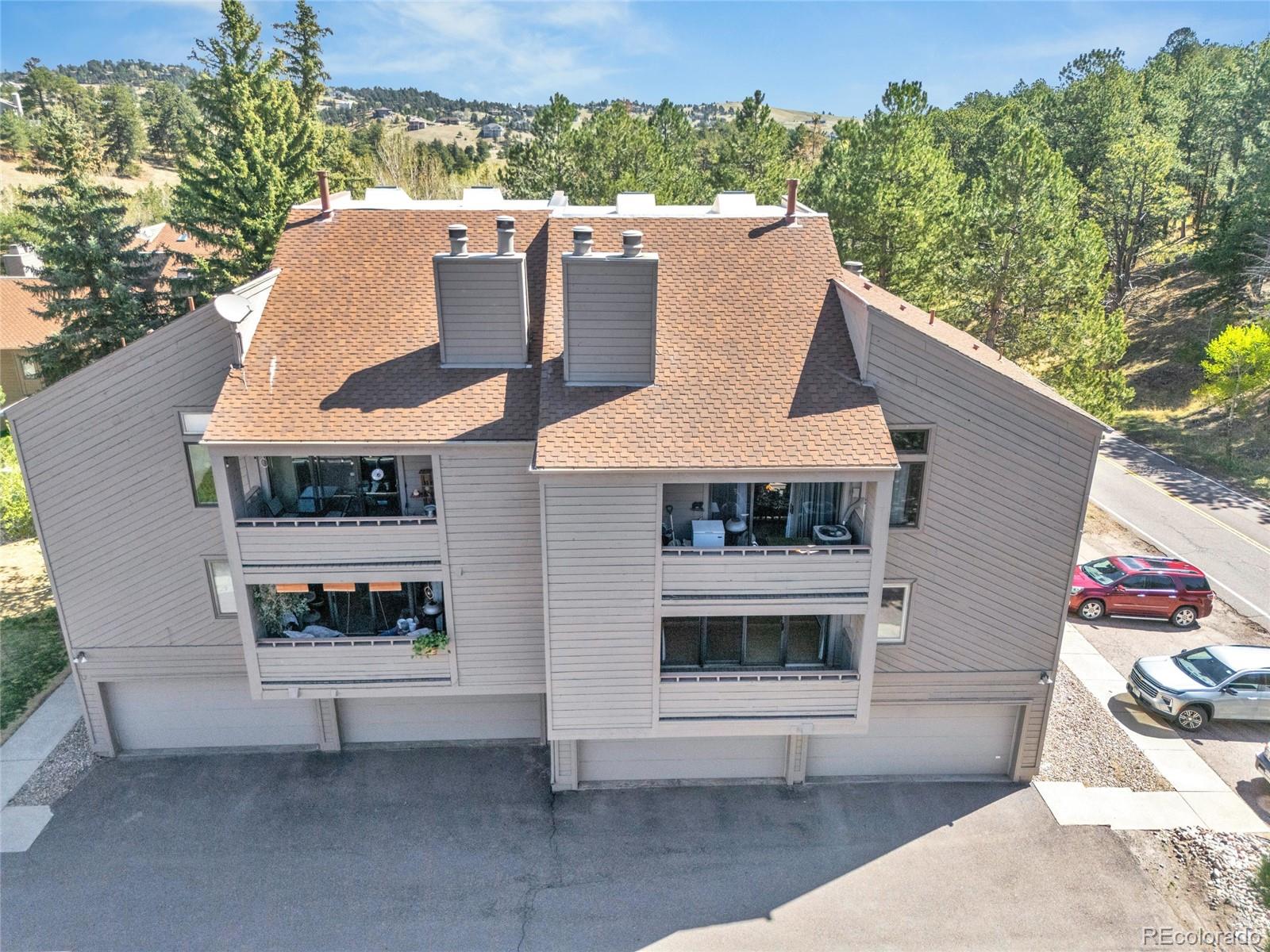 23537 Genesee Village Road Golden, CO 80401 - Photo 23 of 37 a front view of a house with a yard