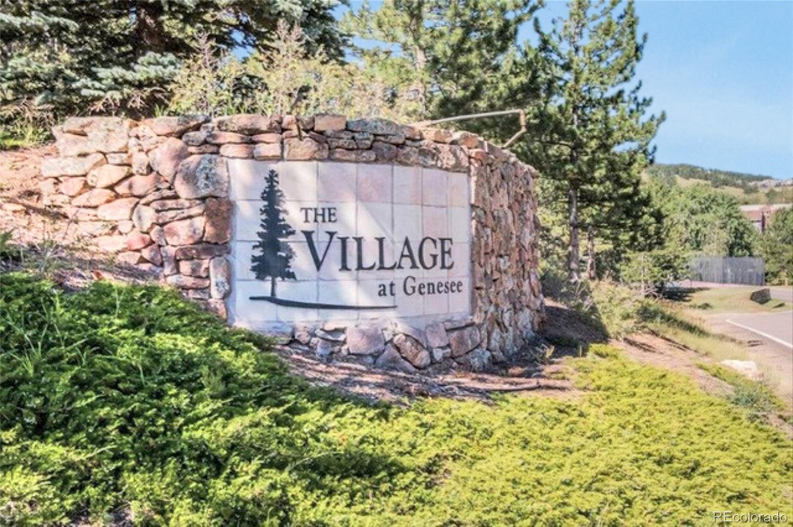 23537 Genesee Village Road Golden, CO 80401 - Photo 24 of 37 a sign on the side of a building
