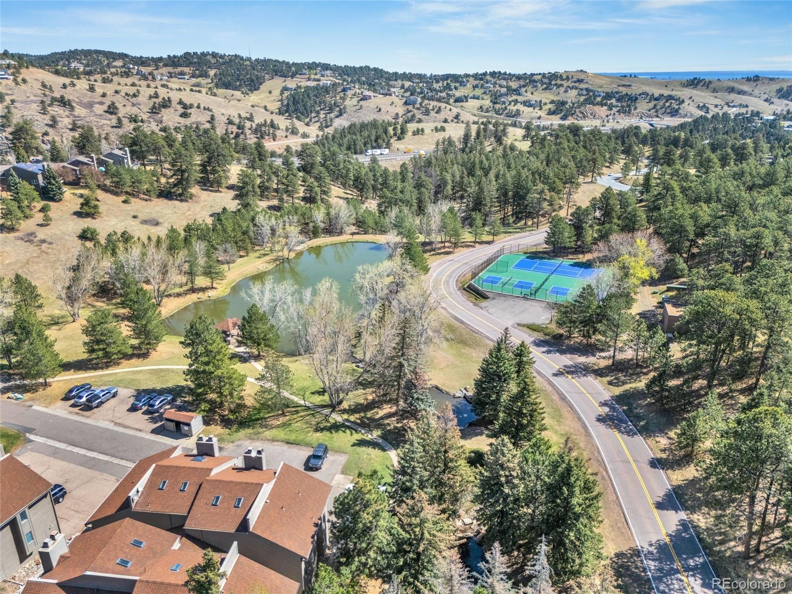 23537 Genesee Village Road Golden, CO 80401 - Photo 30 of 37 an aerial view of residential house with outdoor space