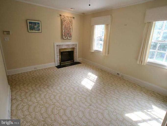 105 Taplow Road Baltimore, MD 21212 - Photo 13 of 14 a view of empty room with windows