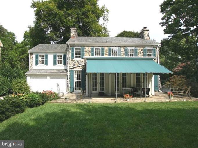 105 Taplow Road Baltimore, MD 21212 - Photo 14 of 14 a front view of a house with a yard garden and seating area
