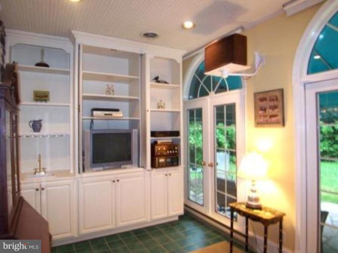 105 Taplow Road Baltimore, MD 21212 - Photo 6 of 14 a view of an entryway with wooden floor