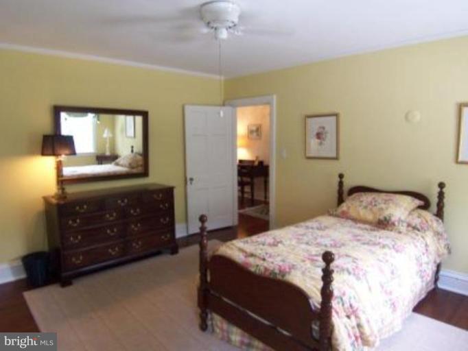 105 Taplow Road Baltimore, MD 21212 - Photo 10 of 14 a bedroom with a bed and a dresser