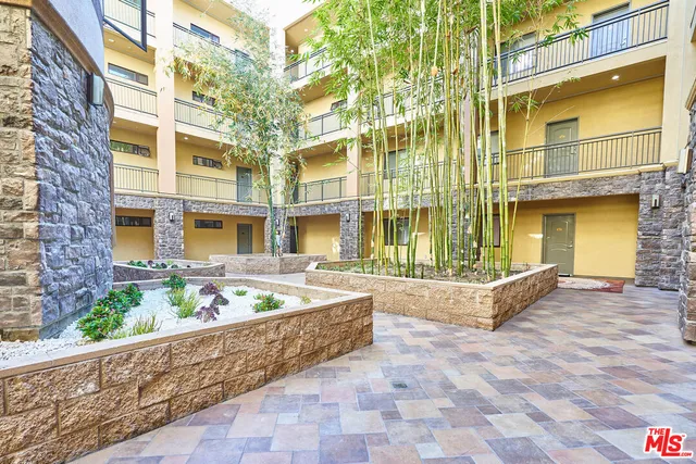 a front view of a building with outdoor seating