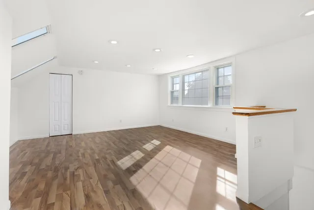 a view of empty room with windows