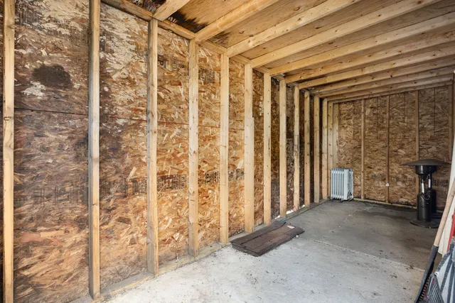 a view of a room with wooden walls