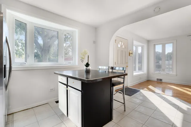 a view of a a dining room with a table and chairs
