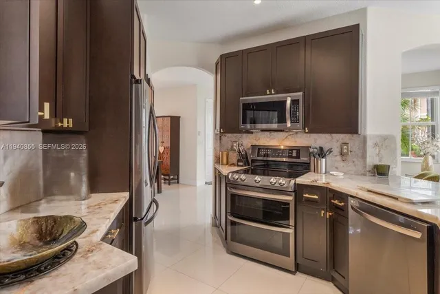 a kitchen with a stove and a microwave