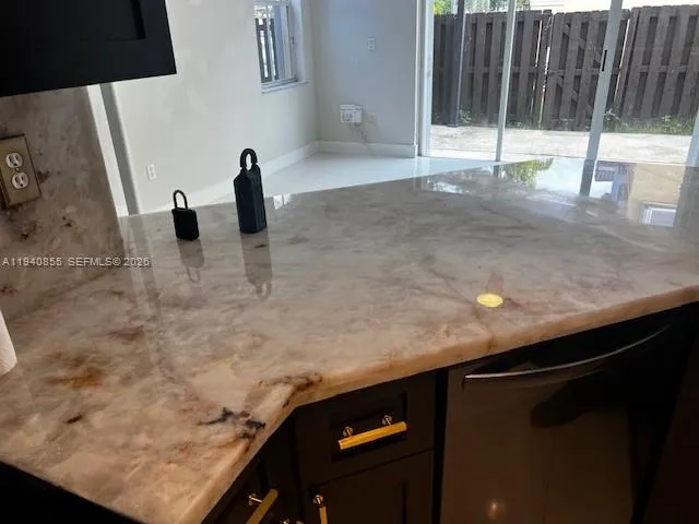 a kitchen with a sink and a window