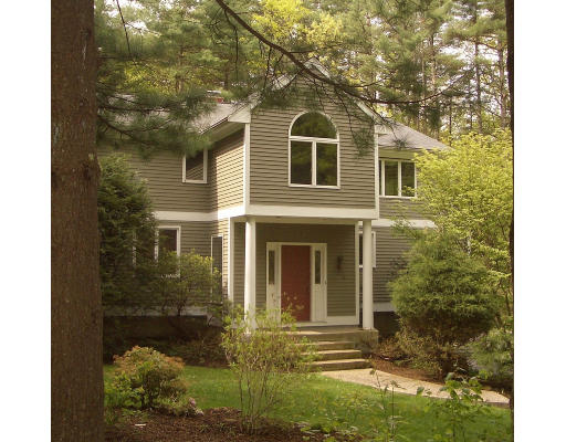 66 South Shaker Road Harvard, MA 01451 - Photo 2 of 26 a front view of a house with a yard
