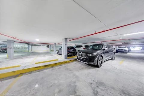 a dining room with furniture and a potted plant