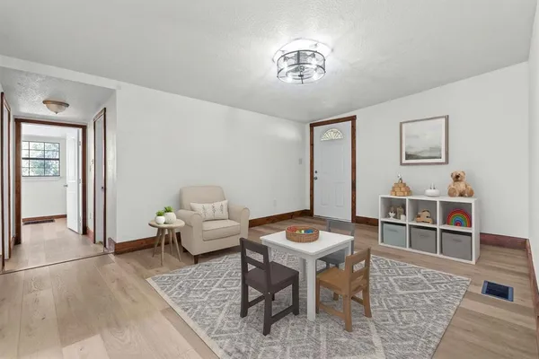 a bedroom with a bed and a table in it