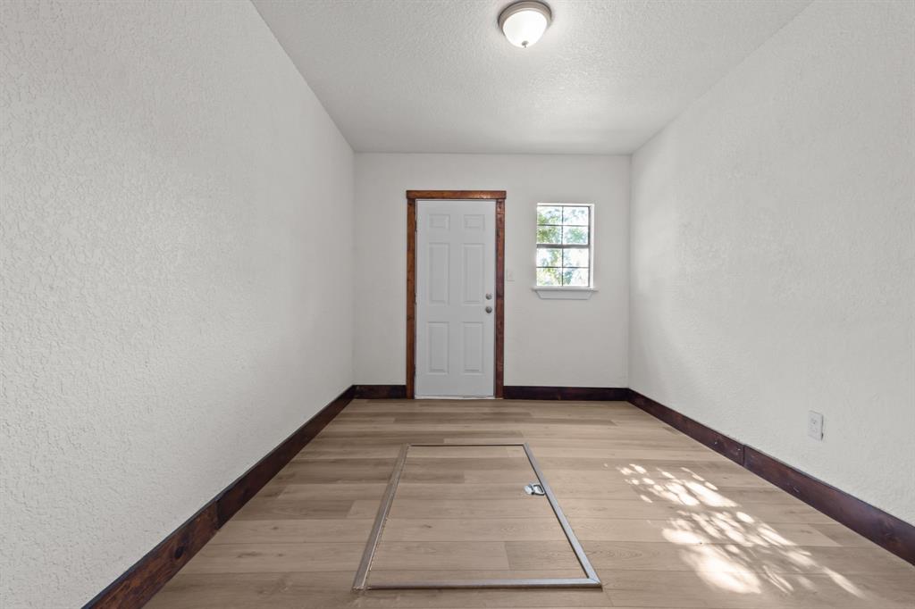 150 Sandlin Court Springtown, TX 76082 - Photo 36 of 39 Storage room or perfect primary walk-in closet with storm cellar