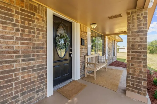 a balcony view with a glass door shower