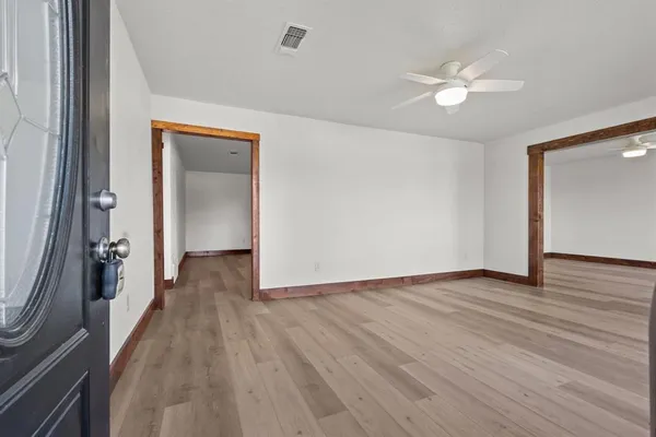 a view of an empty room with a window