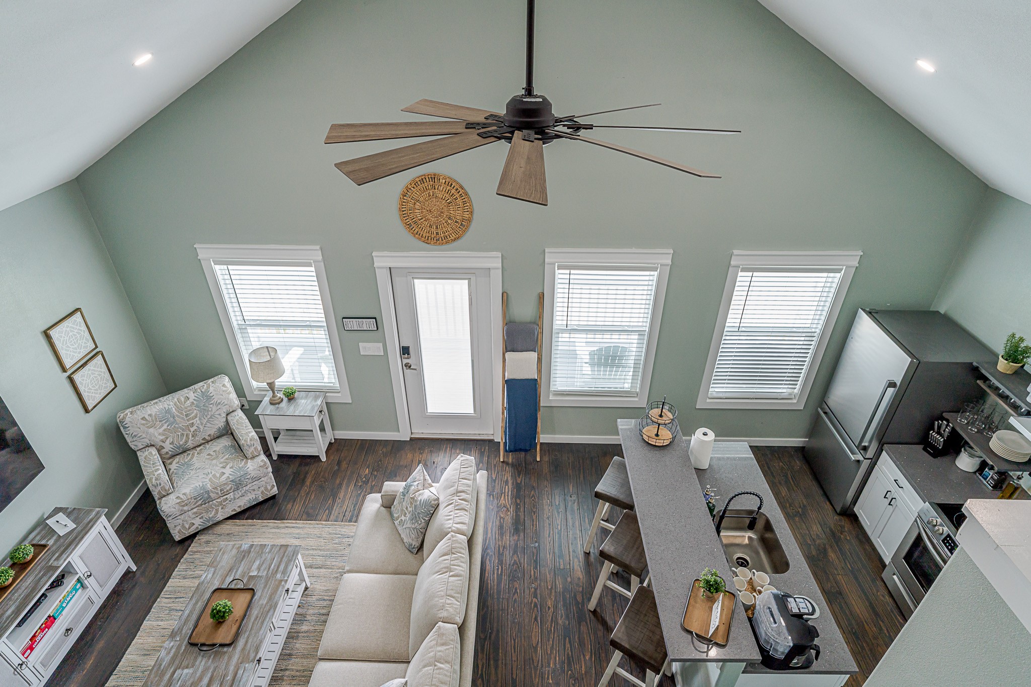 1057 Johnson Road Port Bolivar, TX 77650 - Photo 24 of 40 From the loft, you can take in the open layout below, where the kitchen and living area come together beneath the vaulted ceiling.