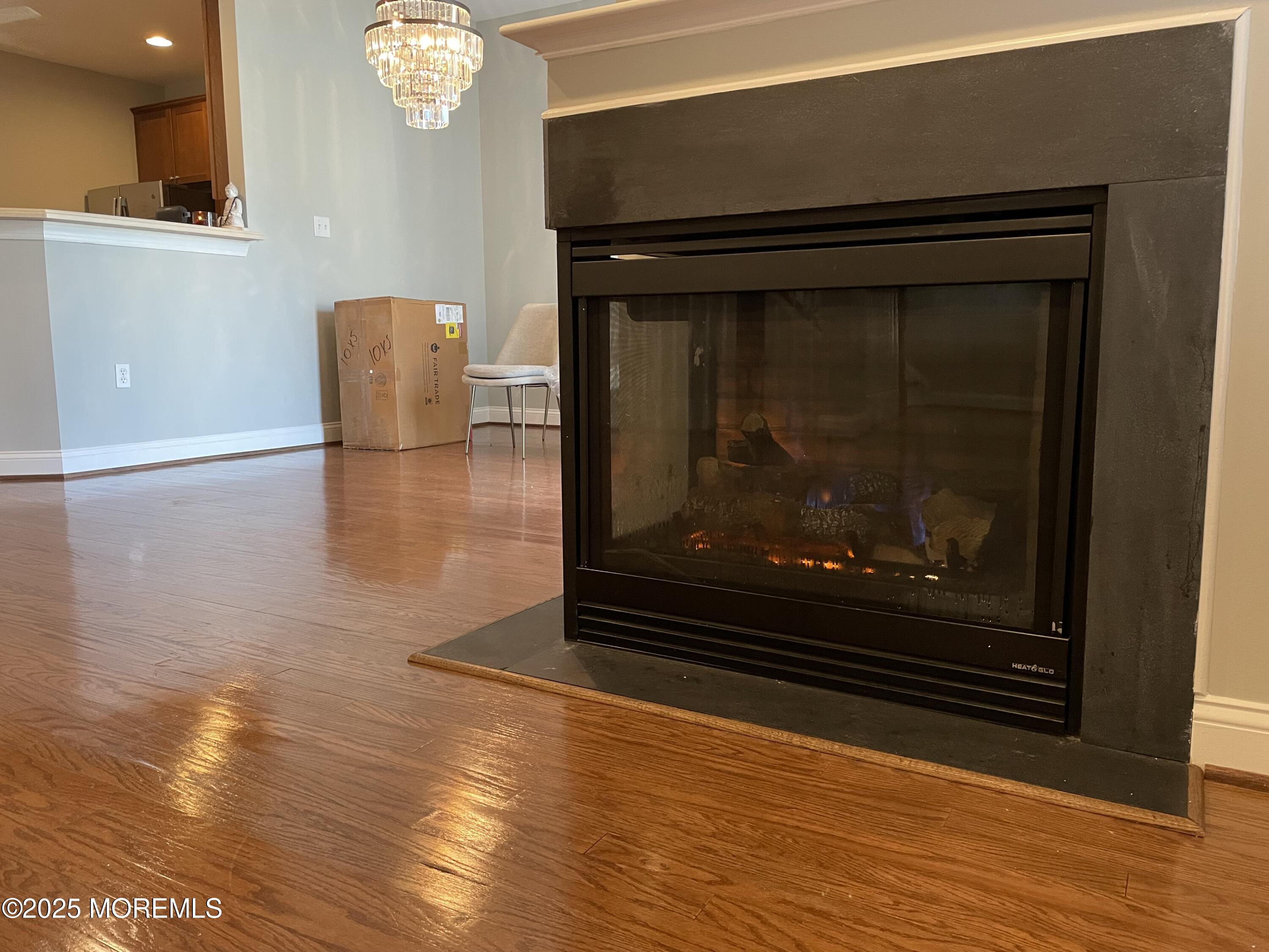 508 Abby Road Middletown, NJ 07748 - Photo 5 of 17 a view of fireplace and wooden floor