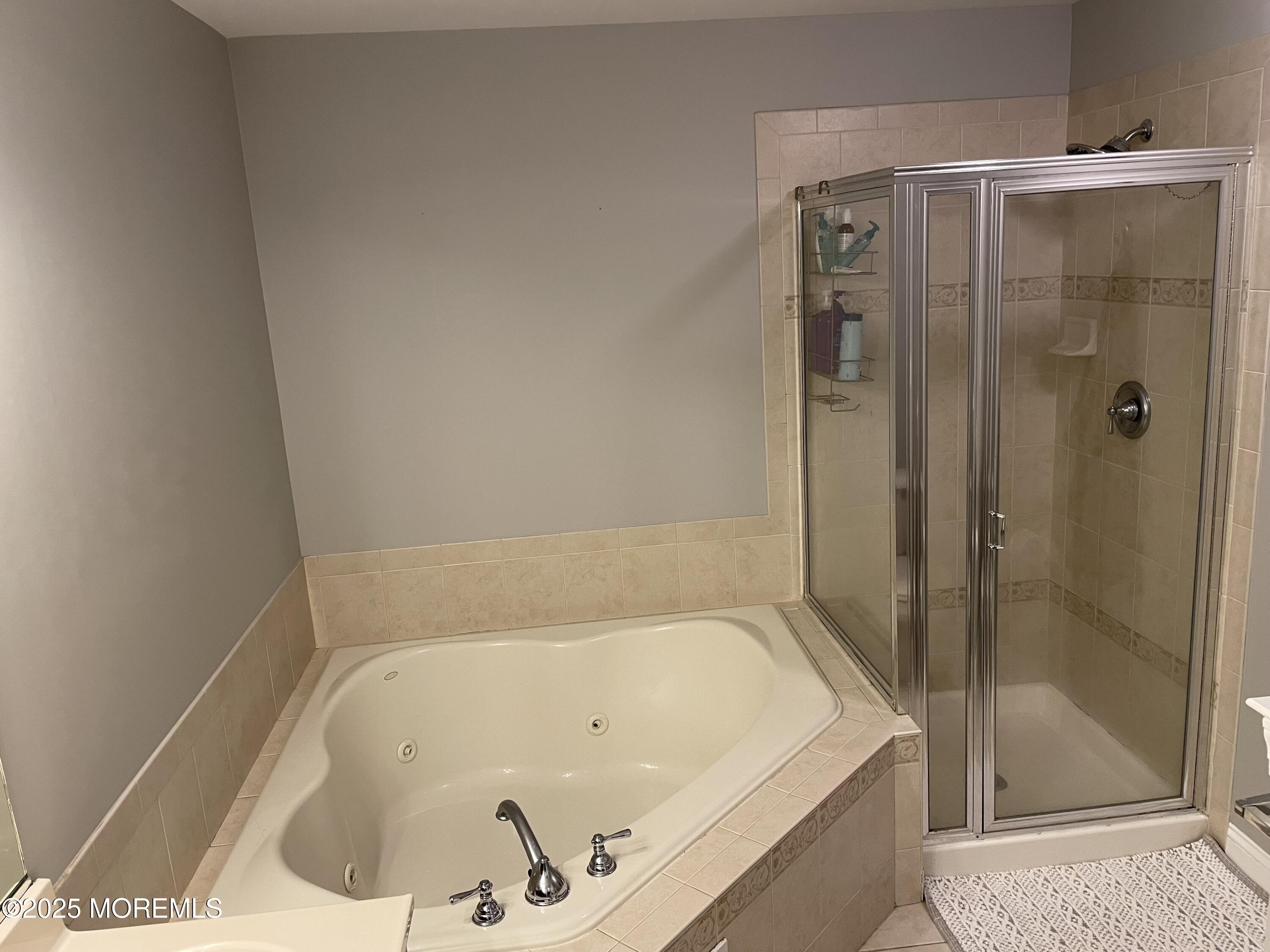508 Abby Road Middletown, NJ 07748 - Photo 9 of 17 a bathroom with a tub and shower