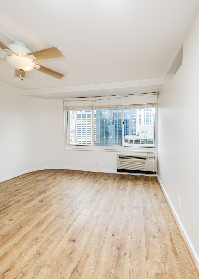 211 East Ohio Street, Unit 2606 Chicago, IL 60611 - Photo 17 of 32 a view of a room with wooden floor and window