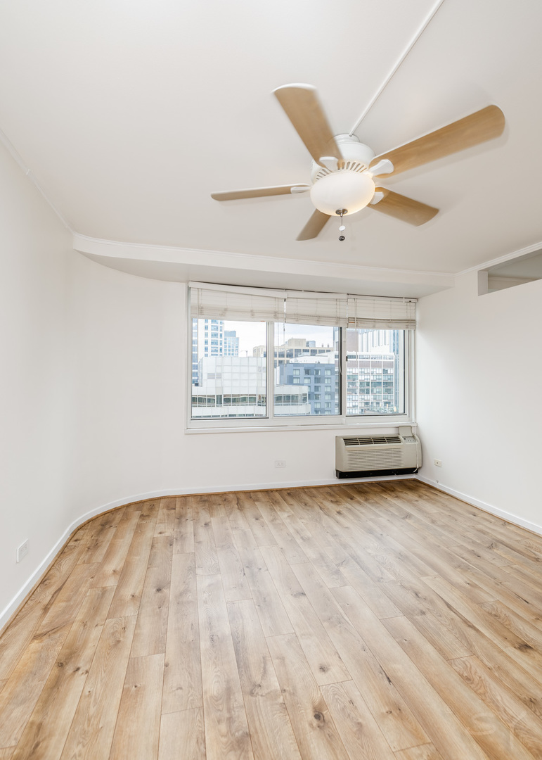211 East Ohio Street, Unit 2606 Chicago, IL 60611 - Photo 18 of 32 a view of an empty room with a window
