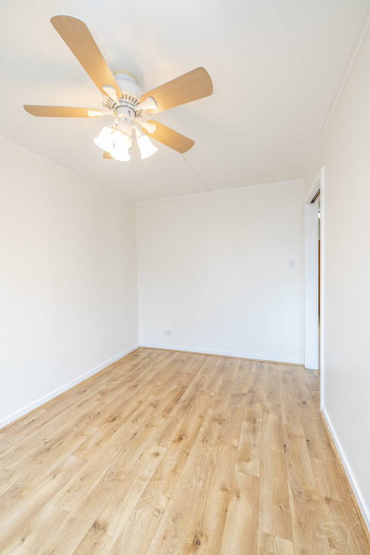 211 East Ohio Street, Unit 2606 Chicago, IL 60611 - Photo 19 of 32 a view of a big room with wooden floor and cabinet