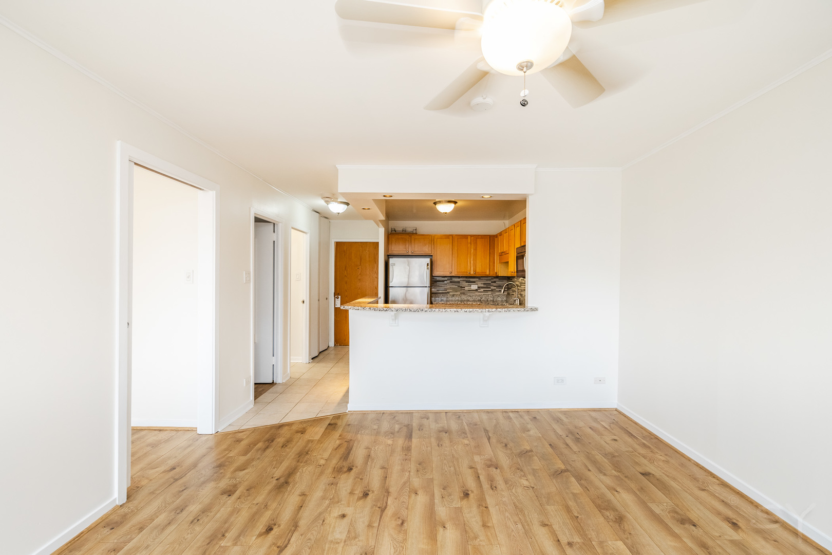 211 East Ohio Street, Unit 2606 Chicago, IL 60611 - Photo 21 of 32 a view of a hallway with wooden floor