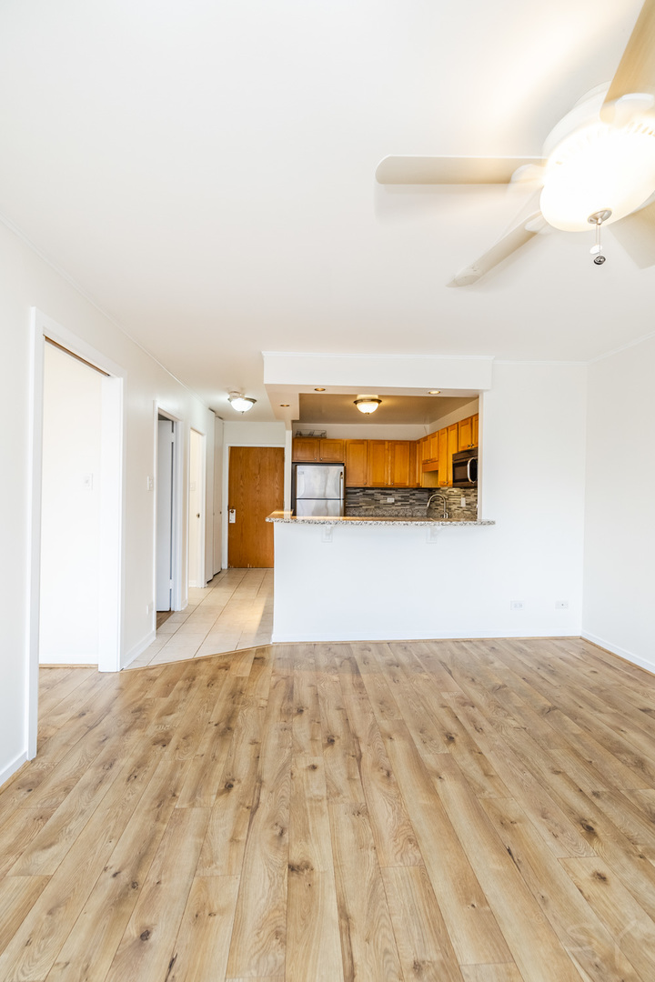 211 East Ohio Street, Unit 2606 Chicago, IL 60611 - Photo 22 of 32 a view of a living room with a wooden floor