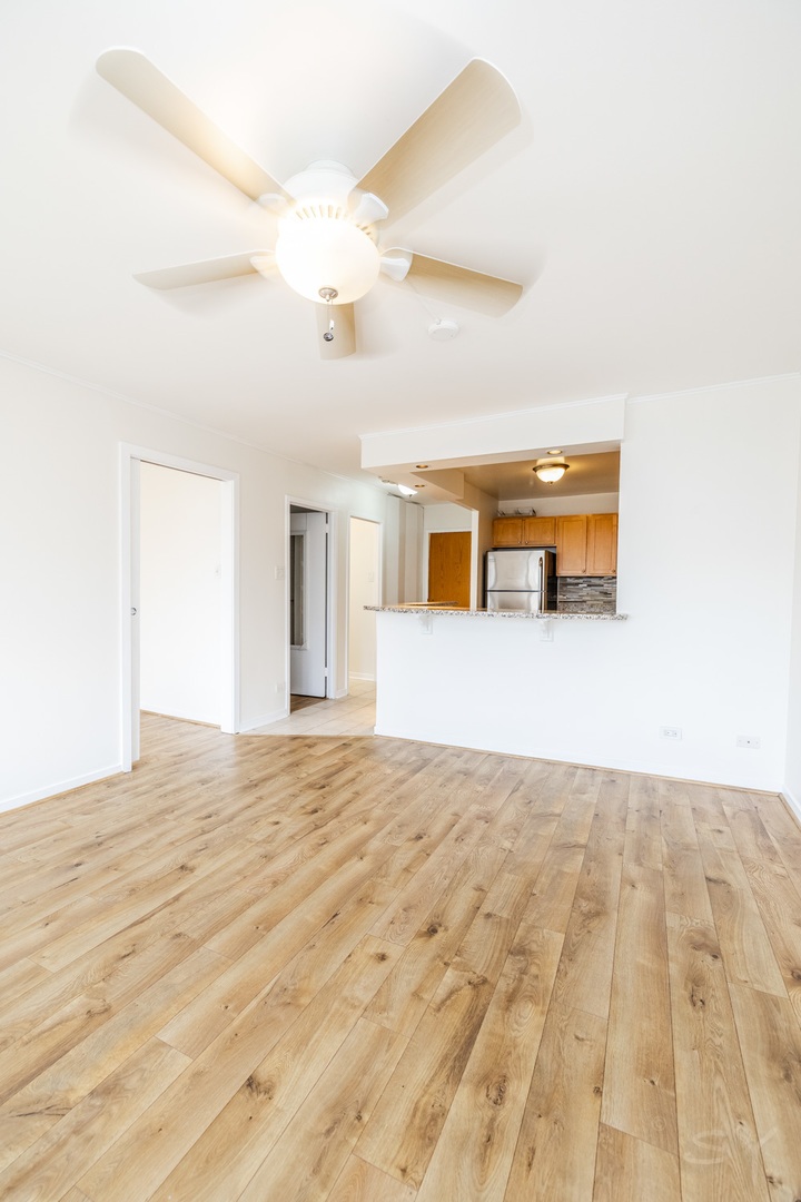 211 East Ohio Street, Unit 2606 Chicago, IL 60611 - Photo 24 of 32 a view of empty room with wooden floor