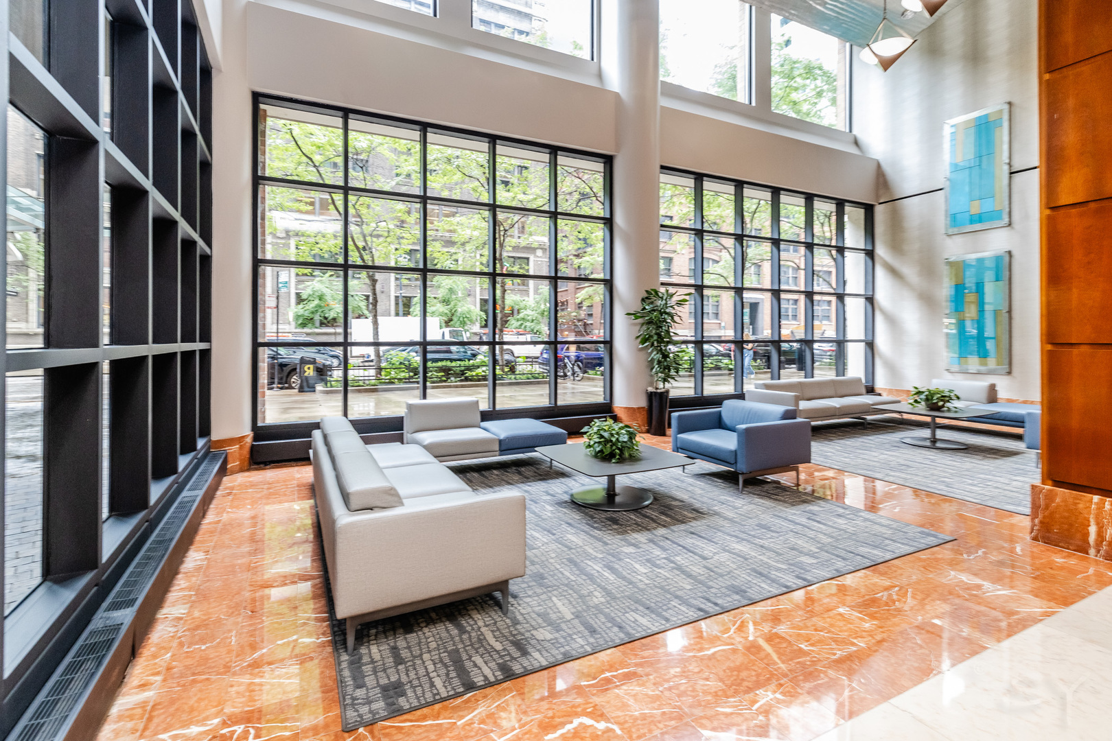 211 East Ohio Street, Unit 2606 Chicago, IL 60611 - Photo 7 of 32 a living room with furniture large windows wooden floor and a table