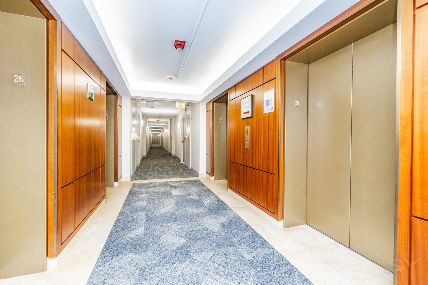 211 East Ohio Street, Unit 2606 Chicago, IL 60611 - Photo 8 of 32 a view of a hallway with wooden floor and a bathroom