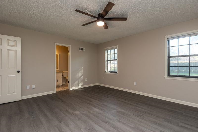 1780 Allenby Road Germantown, TN 38139 - Photo 15 of 26 a view of an empty room with window and wooden floor