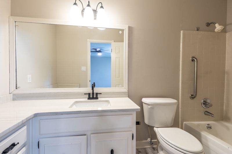 1780 Allenby Road Germantown, TN 38139 - Photo 16 of 26 a bathroom with a sink toilet and shower