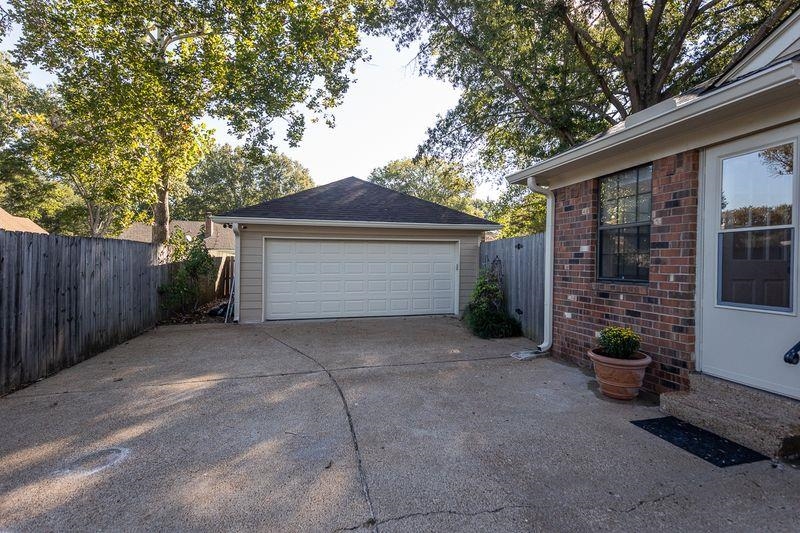1780 Allenby Road Germantown, TN 38139 - Photo 20 of 26 a view of a house with a yard and garage