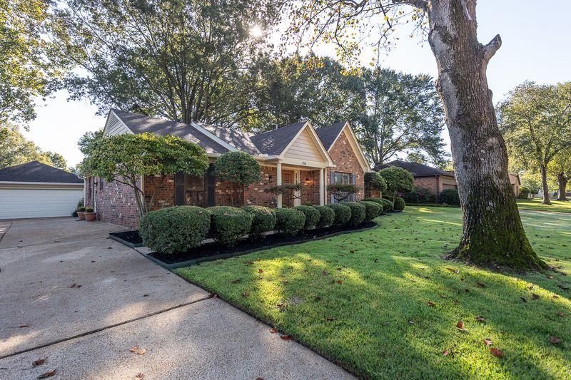 1780 Allenby Road Germantown, TN 38139 - Photo 2 of 26 a front view of a house with yard and green space