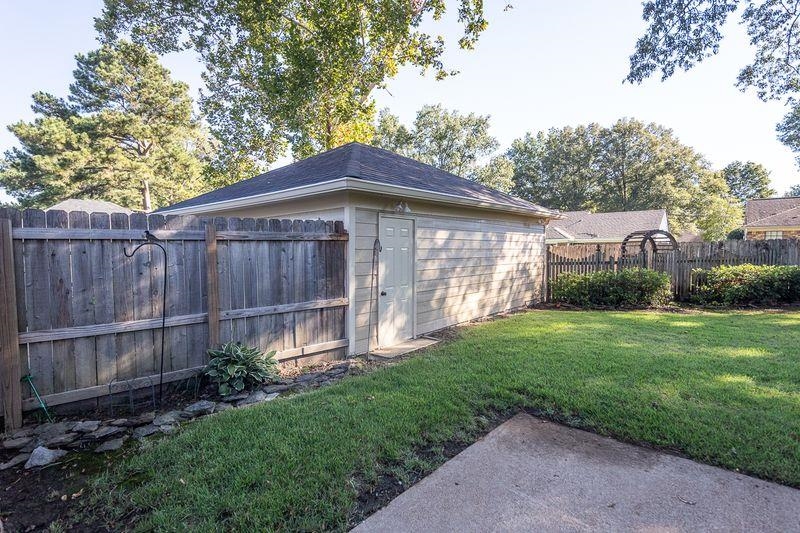 1780 Allenby Road Germantown, TN 38139 - Photo 23 of 26 a backyard of a house with lots of green space