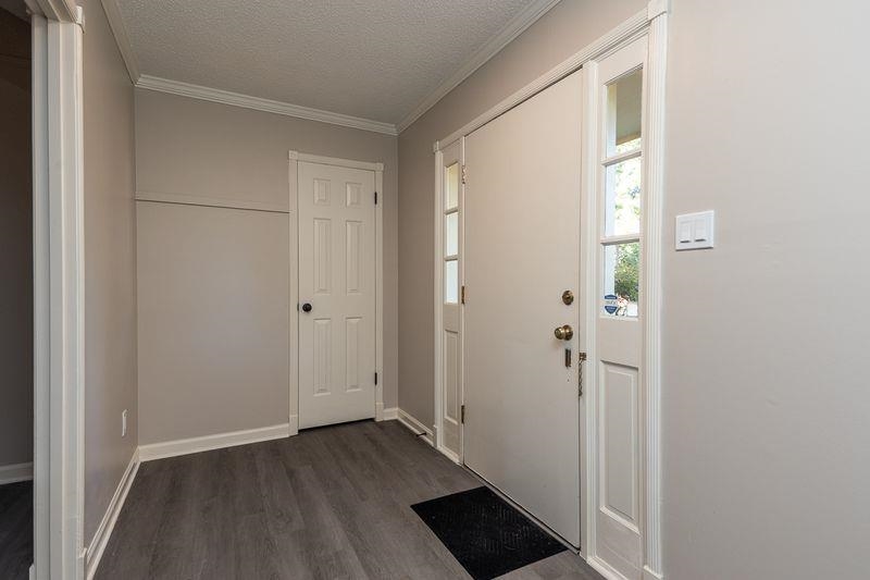 1780 Allenby Road Germantown, TN 38139 - Photo 4 of 26 a view of an empty room with wooden floor and a window