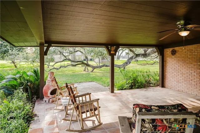 a view of yard with patio