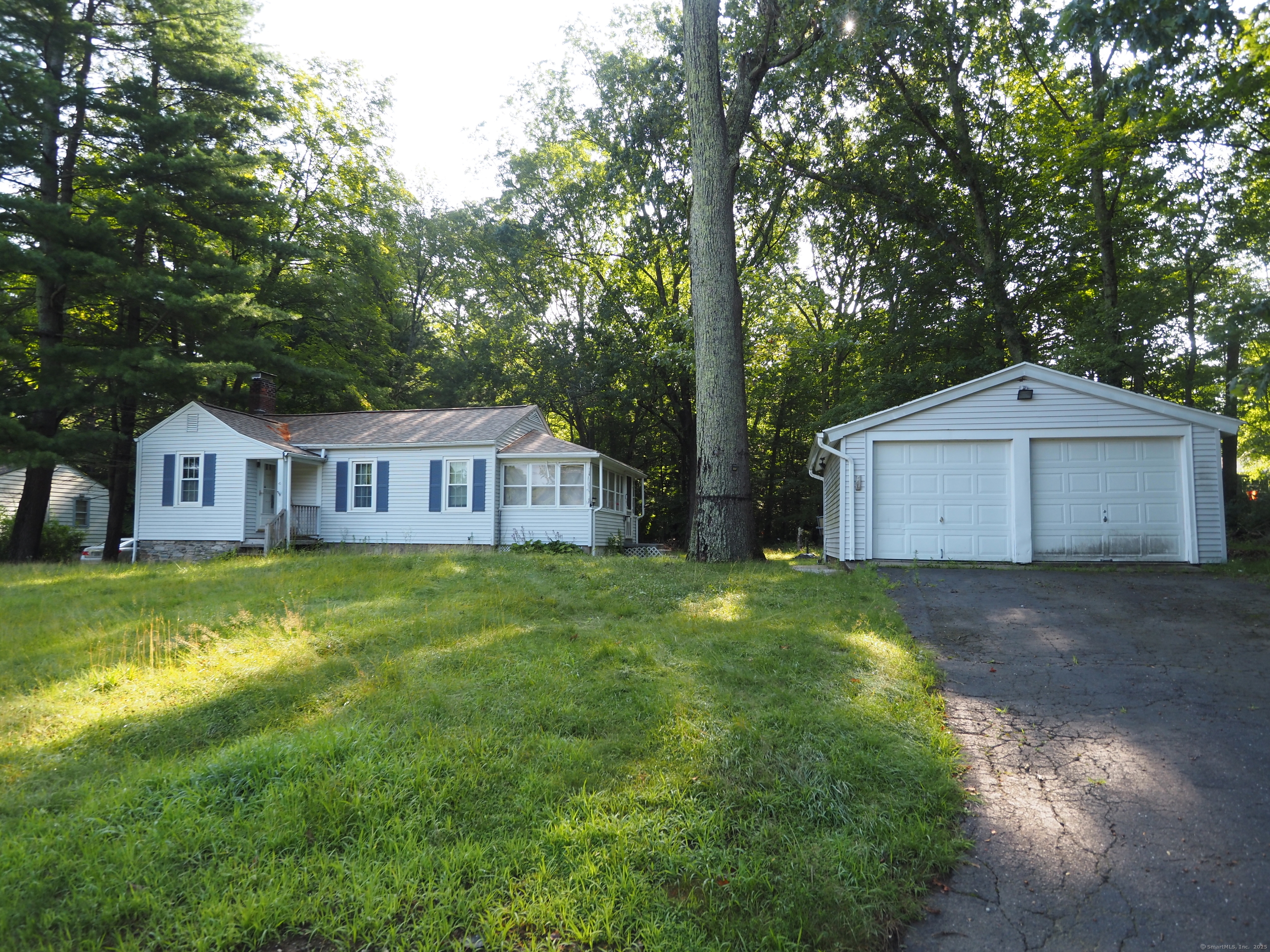 45 Macht Road Columbia, CT 06237 - Photo 1 of 1 a front view of a house with garden