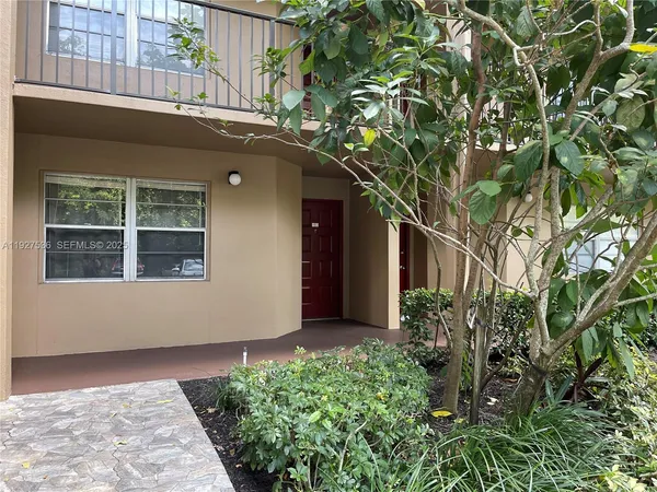 a house with a tree in front of it