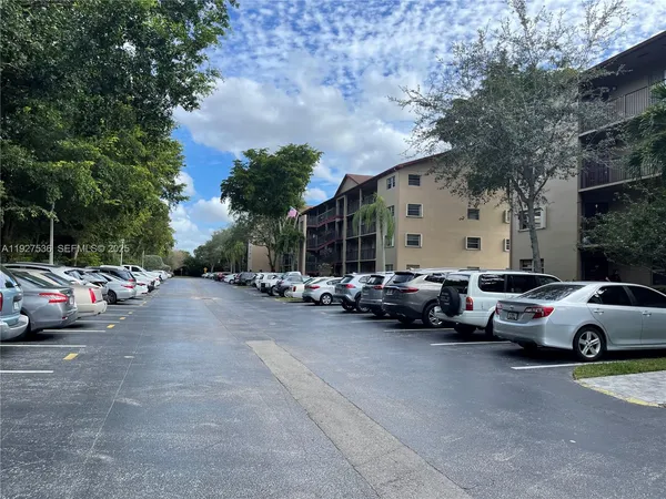 a view of street with parked cars
