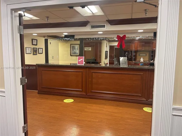 a living room with furniture a chandelier and a fireplace