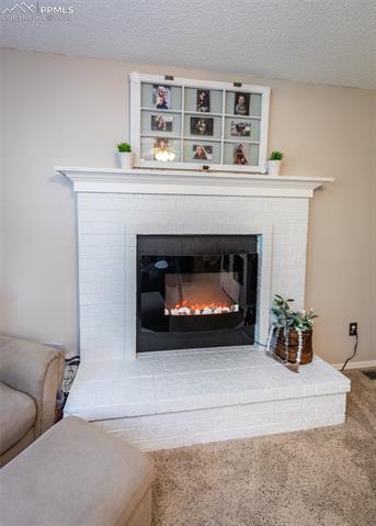 7848 Swiftrun Road Colorado Springs, CO 80920 - Photo 21 of 37 Wood-burning fireplace with electric option installed