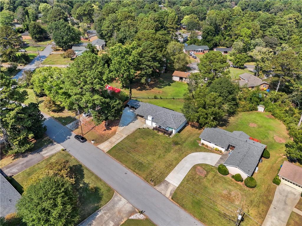 4166 Idlevale Drive Tucker, GA 30084 - Photo 12 of 36 an aerial view of a house with a yard and lake view