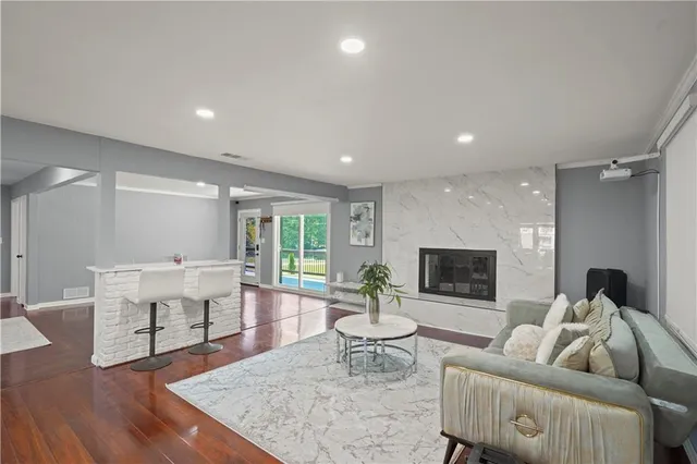 a living room with furniture and a fireplace